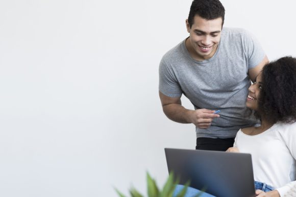 happy-adult-male-woman-working-together